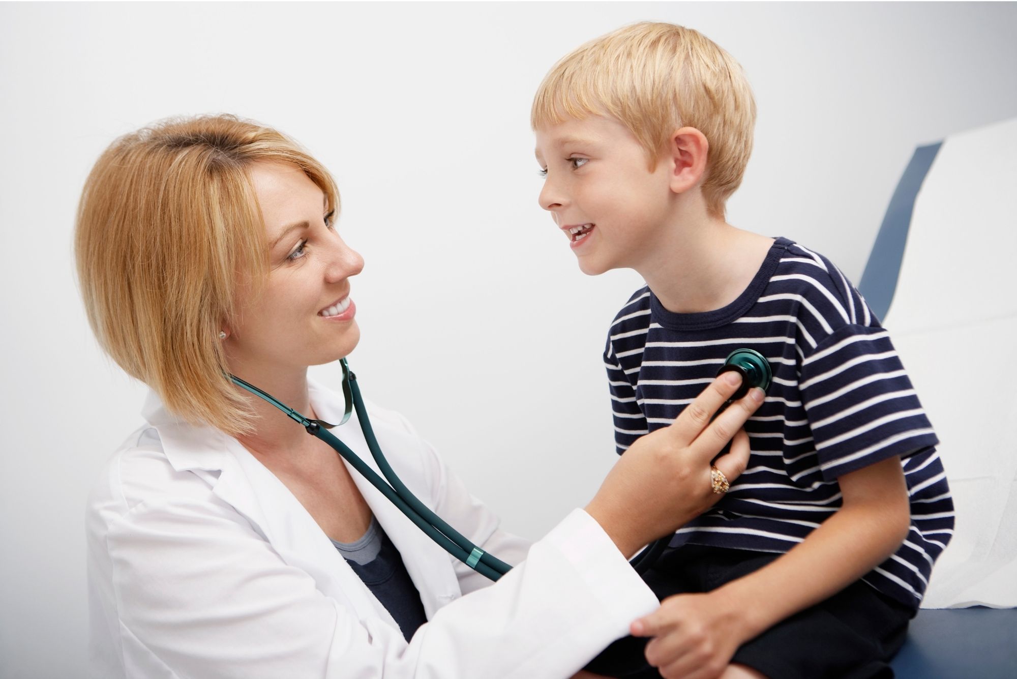 Young boy with doctor having a heart check up in hospital