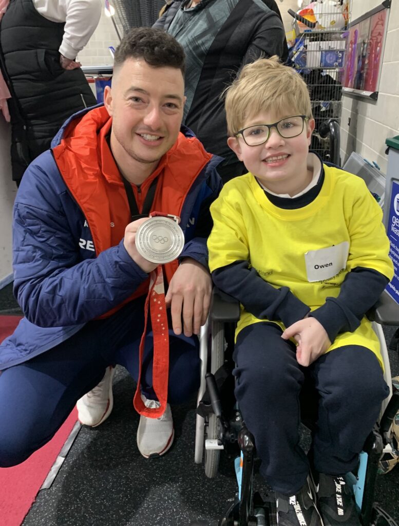 Owen with Team GB curling player Hammy Mcmillan