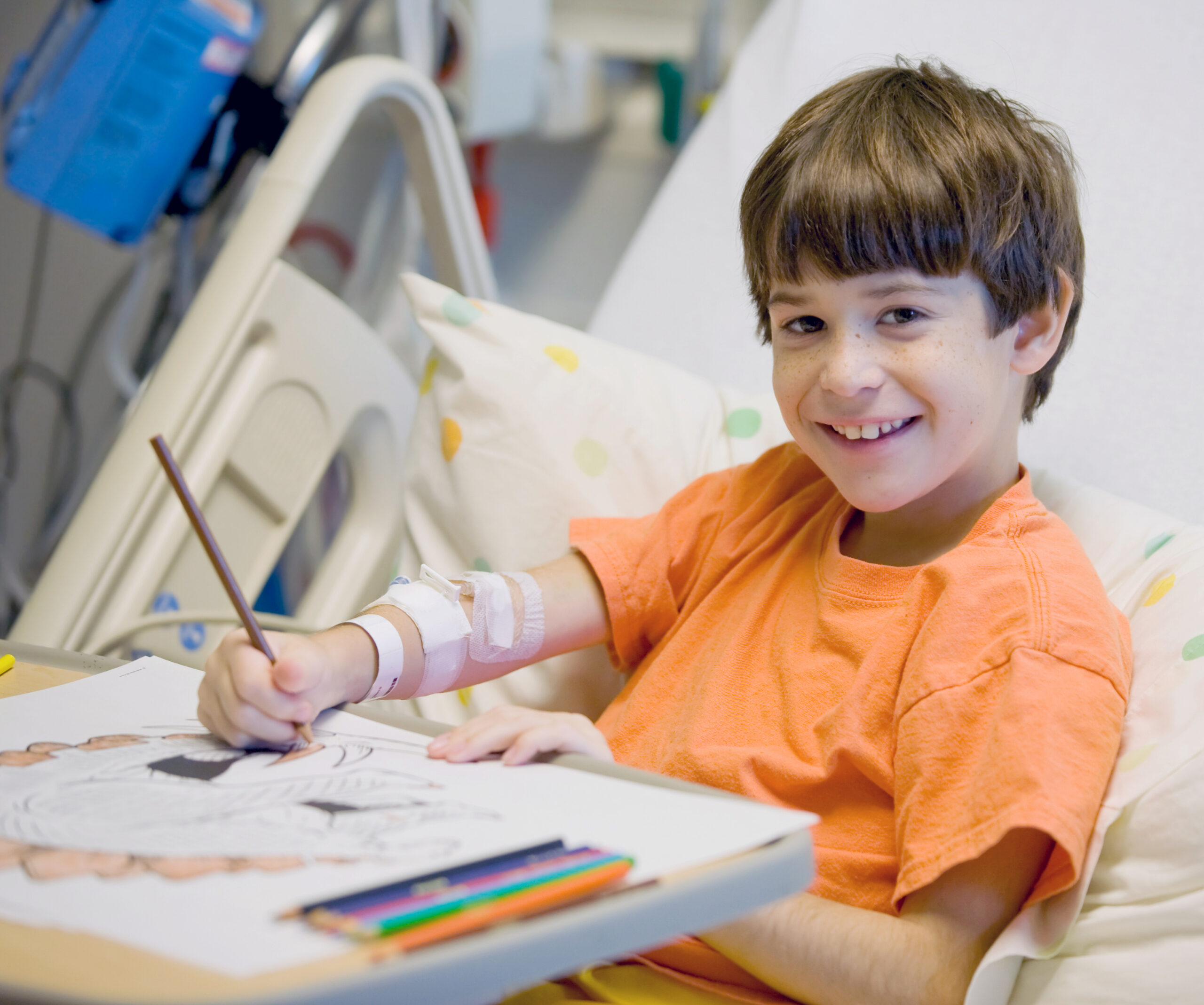 Boy in hospital colouring