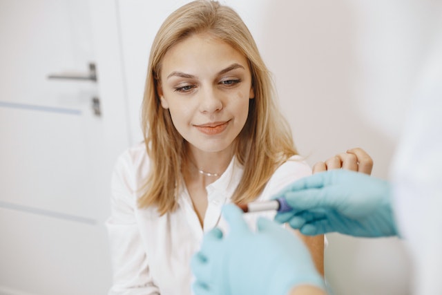 A woman receiving a blood test