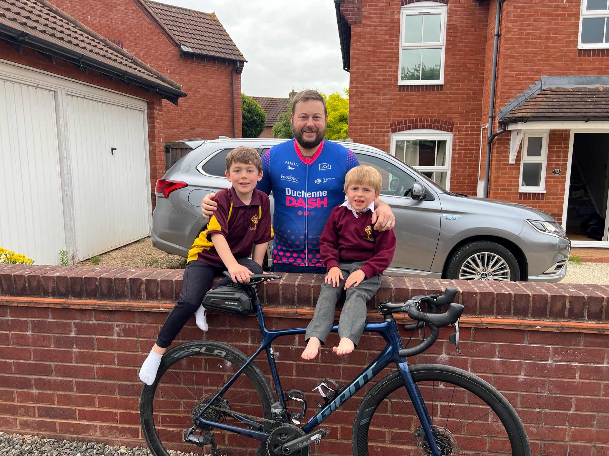 Ross Bennett with his sons, preparing for the Duchenne Dash 2022